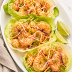 Copycat Bonefish Grill Bang Bang Shrimp Lettuce Wraps with crispy shrimp, creamy spicy sauce, cabbage, carrots, and green onions.