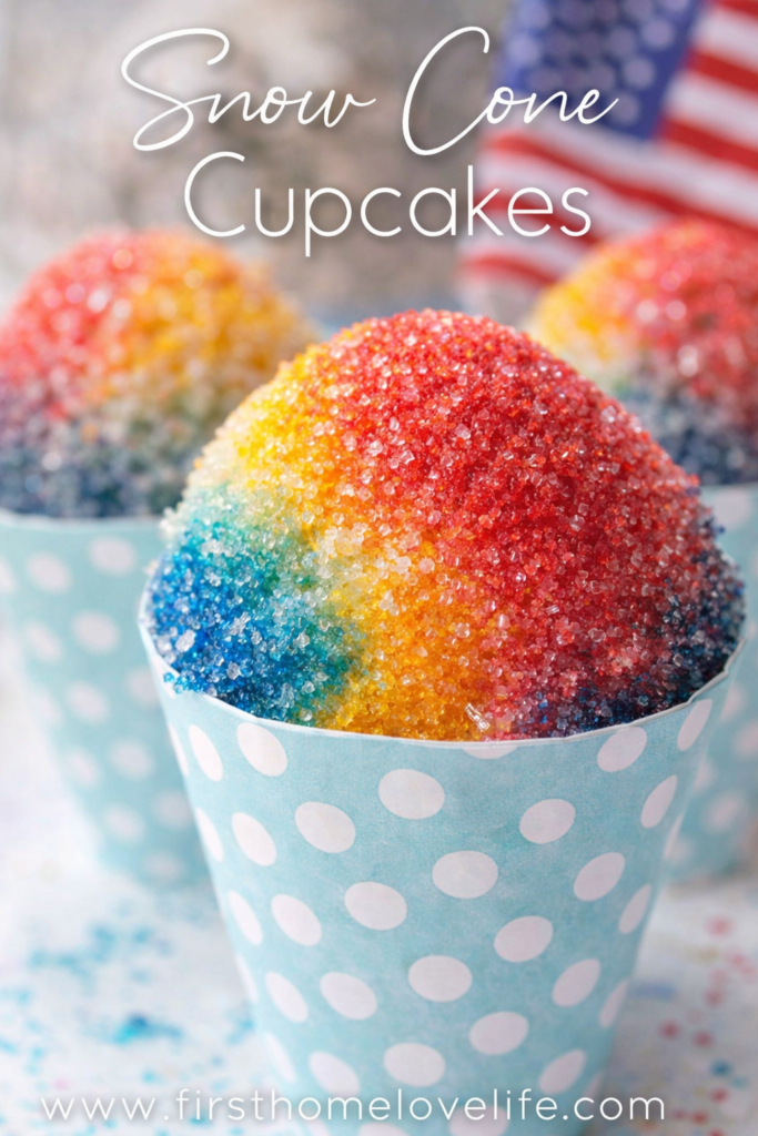 Snow cone cupcakes with red, yellow, and blue sugar topping in pastel paper cones