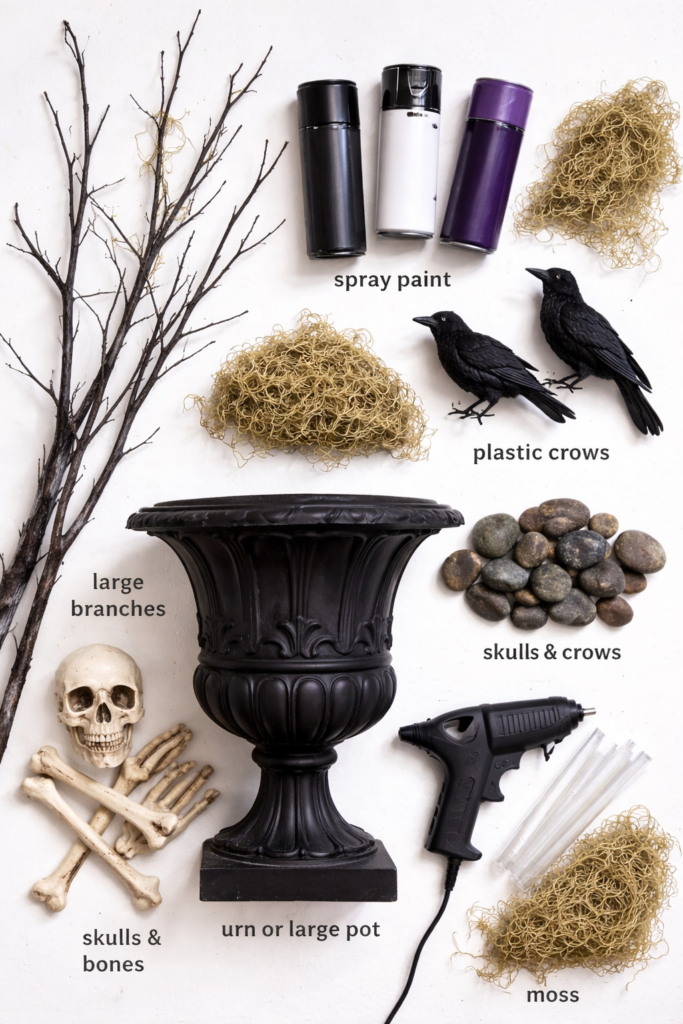 Flat lay of supplies needed for a DIY Halloween tree including branches, black urn, spray paint, moss, rocks, skulls, bones, and black crows on a white background.