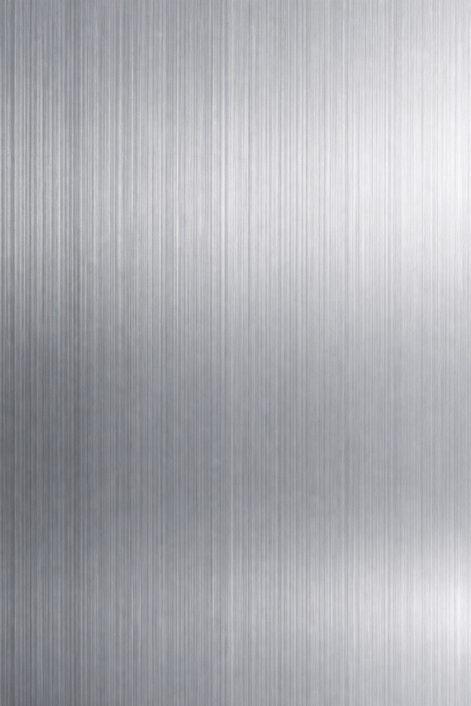 Close-up of brushed stainless steel showing vertical grain pattern and fine parallel lines
