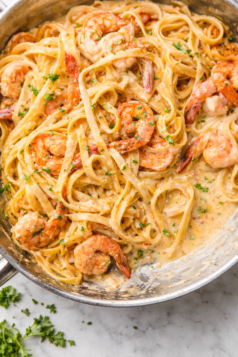 Creamy Cajun seafood boil pasta with shrimp and crab in garlic butter sauce served in skillet