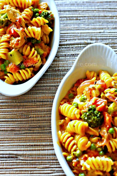 This easy and delicious ONE POT PASTA ROSA is absolutely divine! Jam packed with chicken, sausage and veggies in a cheesy tomato sauce-it's sure to be a hit