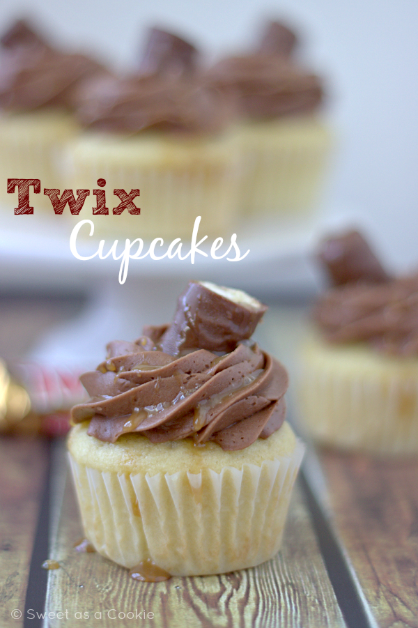 Twix Cupcakes | Vanilla cupcakes with caramel filling and chocolate buttercream frosting via Sweet as a Cookie