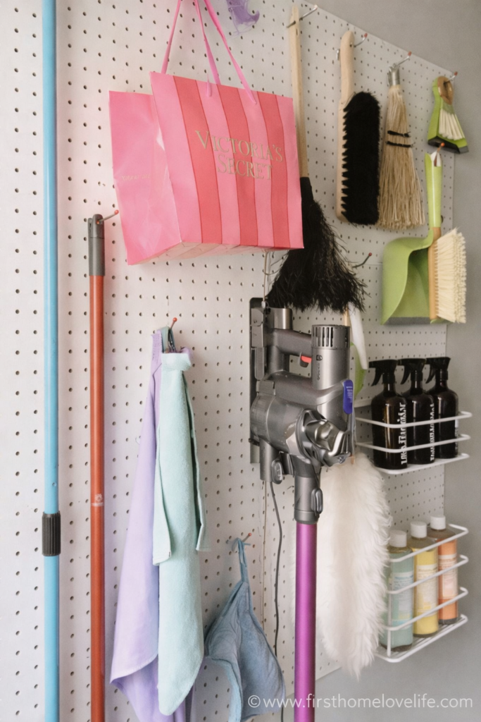 cleaning command center pegboard organization with cleaning supplies and tools