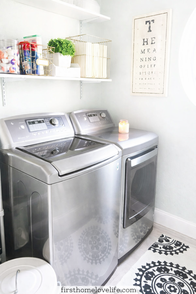 bright organized laundry room refresh with stainless washer dryer shelves and baskets