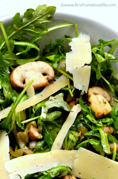 Warm mushroom arugula salad with parmesan cheese and lemon vinaigrette 