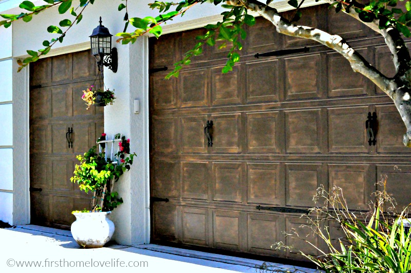 wood painted garage doors via firsthomelovelife.com