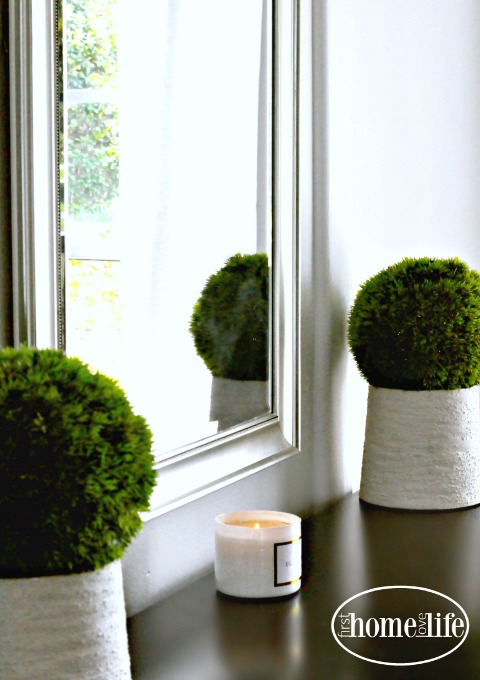 moss balls and white candle via firsthomelovelife.com