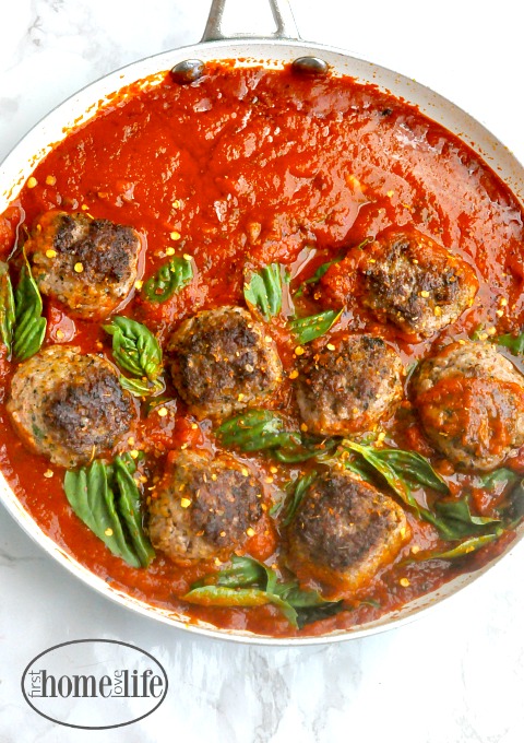 Spicy meatballs and marinara is the perfect italian recipe to go with pasta or to make meatball subs. It's even great to eat on it's own with a salad! via firsthomelovelife.com