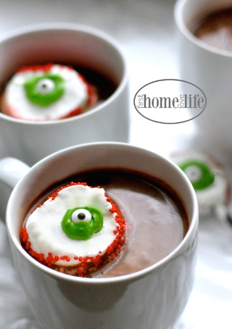 floating eyeballs made out of marshmallows in hot chocolate via firsthomelovelife.com