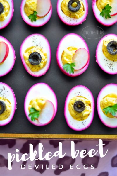 PICKLED BEET DEVILED EGGS SHOULD BE CALLED PARTY EGGS! THEY'RE HOT PINK AND DELICIOUS! GET THE RECIPE FOR THIS FUN APPETIZER AT FIRSTHOMELOVELIFE.COM