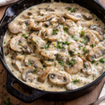 Creamy mushrooms in sour cream sauce served in a cast iron skillet, easy 20-minute mushroom side dish