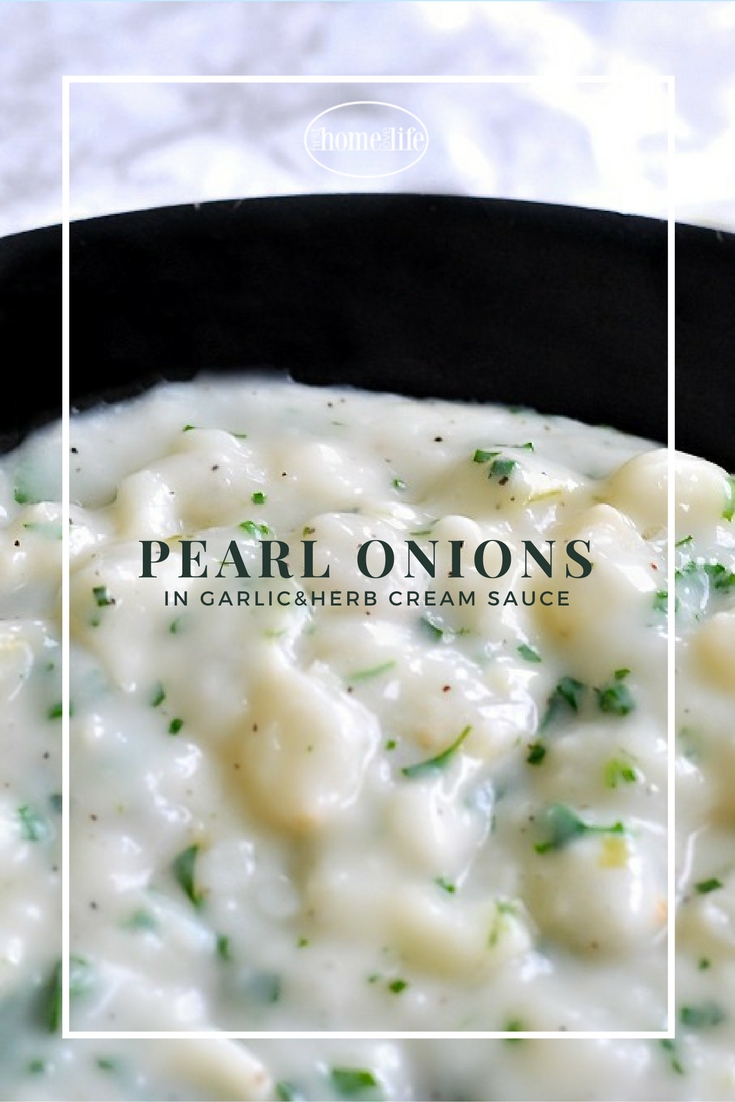 Delicious pearl onions in a creamy garlic herb sauce is the perfect side dish recipe to serve during your holiday meal! via fi
