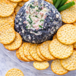 smokey ham crack dip cheese ball coated in poppy seeds and served with round crackers