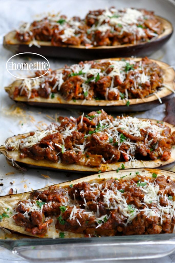 a healthier take on eggplant parmesan. These stuffed eggplant parmesan boats are overflowing with a thick and hearty ground turkey meat sauce for a low carb dinner favorite! via firsthomelovelife.com