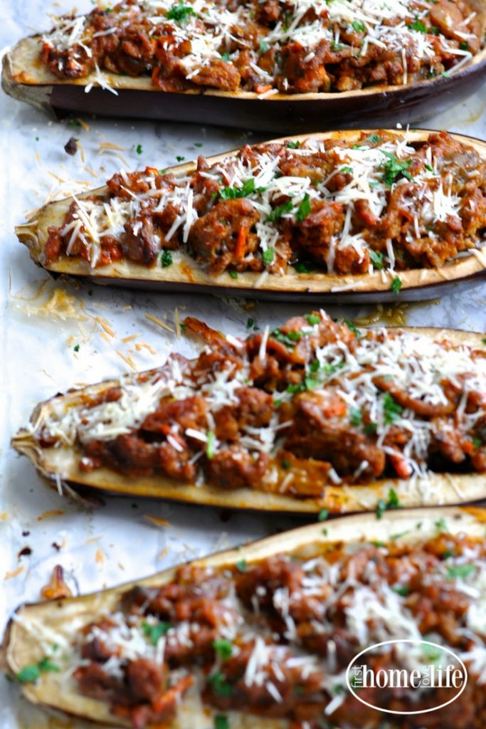 a healthier take on eggplant parmesan. These stuffed eggplant parmesan boats are overflowing with a thick and hearty ground turkey meat sauce for a low carb dinner favorite! via firsthomelovelife.com