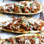 a healthier take on eggplant parmesan. These stuffed eggplant parmesan boats are overflowing with a thick and hearty ground turkey meat sauce for a low carb dinner favorite! via firsthomelovelife.com