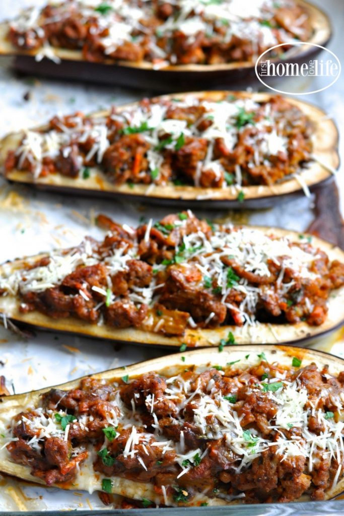 a healthier take on eggplant parmesan. These stuffed eggplant parmesan boats are overflowing with a thick and hearty ground turkey meat sauce for a low carb dinner favorite! via firsthomelovelife.com