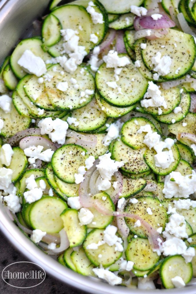 this sauteed zucchini with feta is a quick and delicious side dish that pairs great with anything! Recipe via firsthomelovelife.com