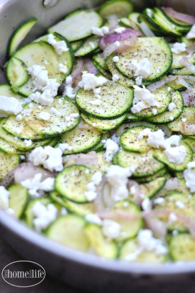 this sauteed zucchini with feta is a quick and delicious side dish that pairs great with anything! Recipe via firsthomelovelife.com