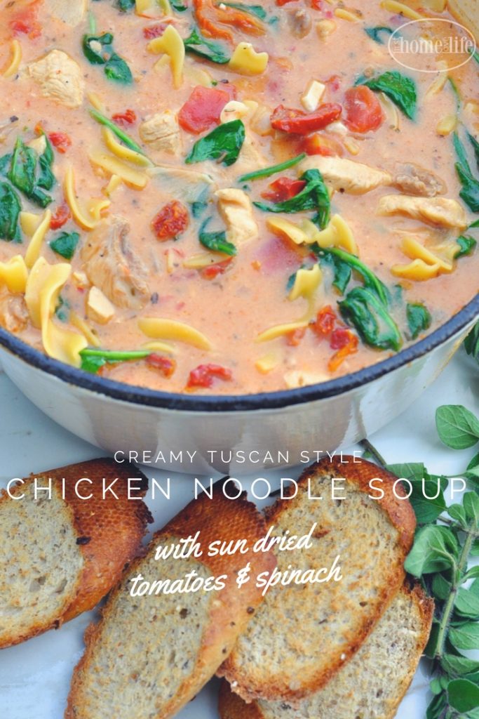 Creamy Tuscan chicken noodle soup is the perfect cold weather meal! Loaded with chicken, noodles, sun dried tomatoes and spinach in a creamy garlic tomato broth! via firsthomelovelife.com