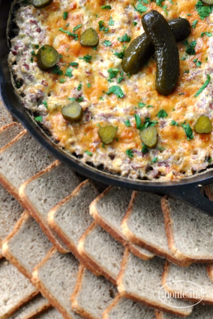 This game day favorite appetizer is the perfect party starter! Get the recipe for this Hot Roast Beef Dip served with rye bread toasts- yum! via firsthomelovelife.com