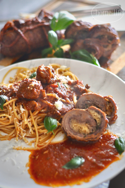 BRACIOLE, ROLLED UP FLANK STEAK WITH CHEESE AND BREADCRUMBS COOKED IN TOMATO SAUCE VIA FIRSTHOMELOVELIFE.COM