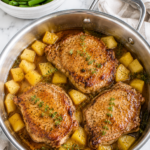 Easy pineapple pork chops cooked in a one pan skillet with fresh pineapple chunks, thyme, and a sweet savory pineapple glaze served with green beans.
