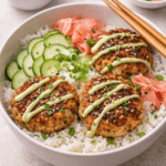 Asian crab cake rice bowls with jasmine rice, cucumber, pickled ginger, and wasabi mayo drizzle