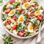 Creamy bacon and egg pasta salad with fresh spinach