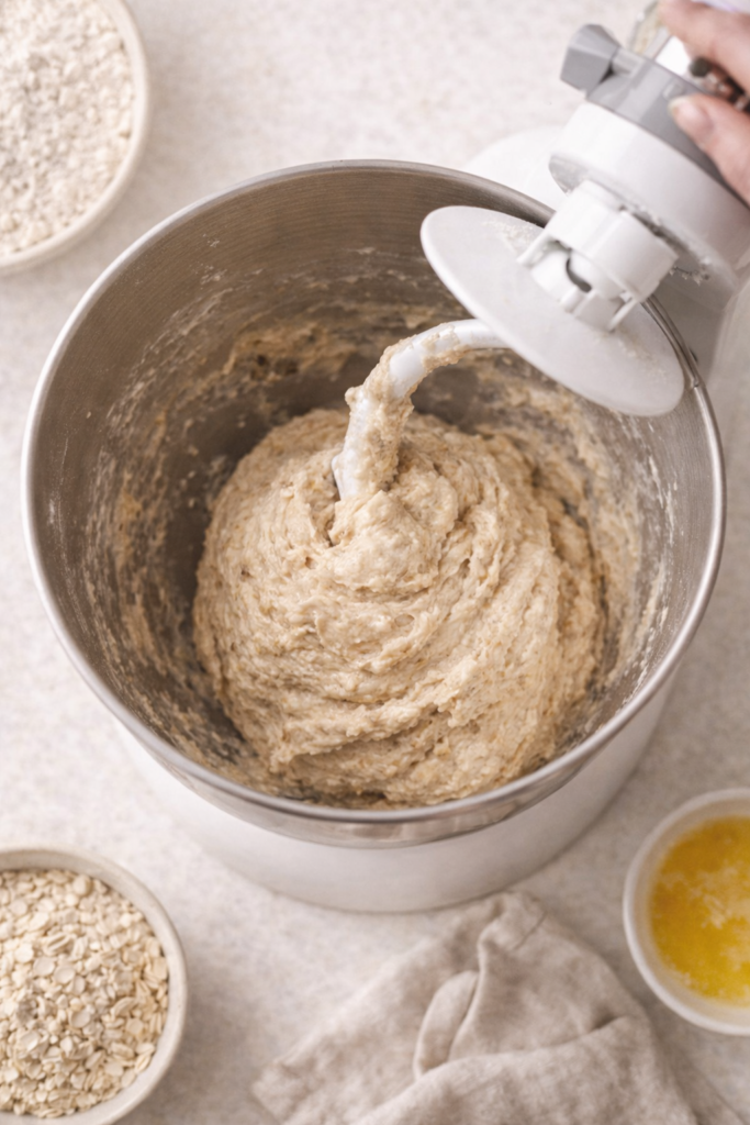 Banana monkey bread dough mixing in a stand mixer with a dough hook