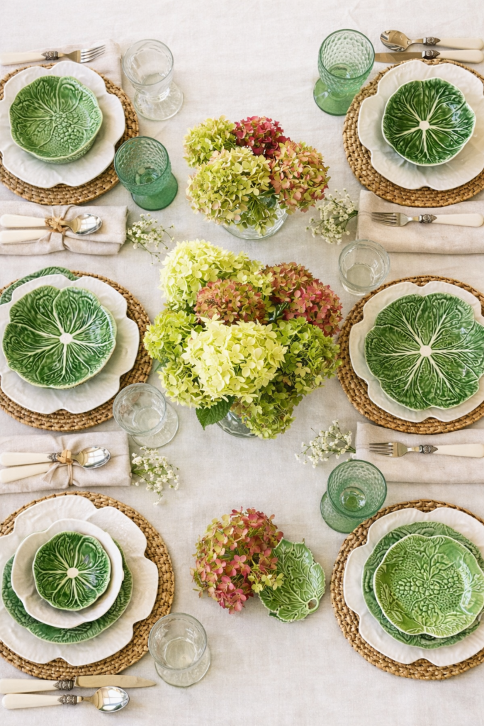 cabbageware spring tablescape with green cabbage plates, white linens, and hydrangea centerpiece