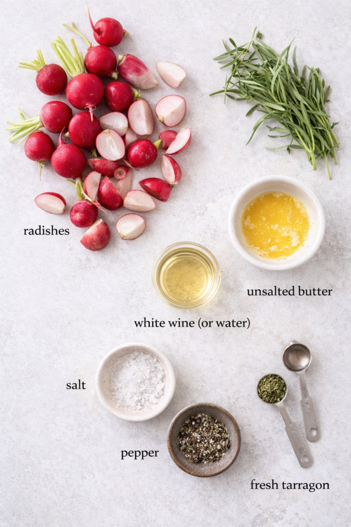 Flat lay of ingredients for roasted tarragon radishes including fresh radishes, butter, white wine, salt, pepper, and tarragon on a neutral background
