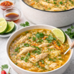 Saigon chicken rice soup with golden broth and shredded chicken served in a bowl