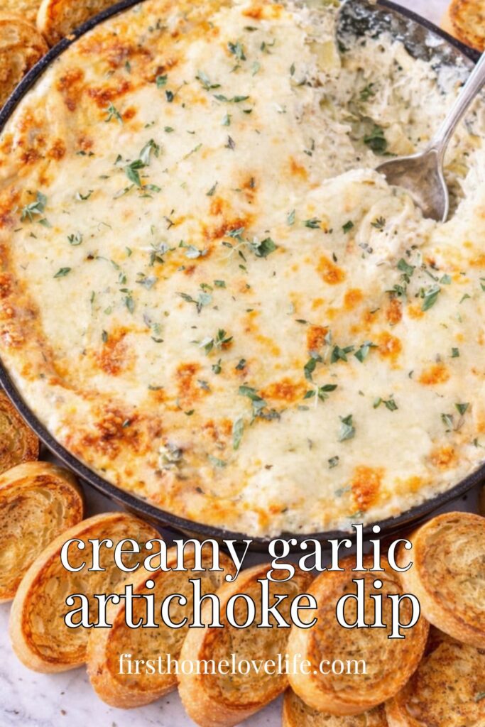 creamy garlic artichoke dip baked in skillet with melted cheese and toasted baguette slices with text overlay