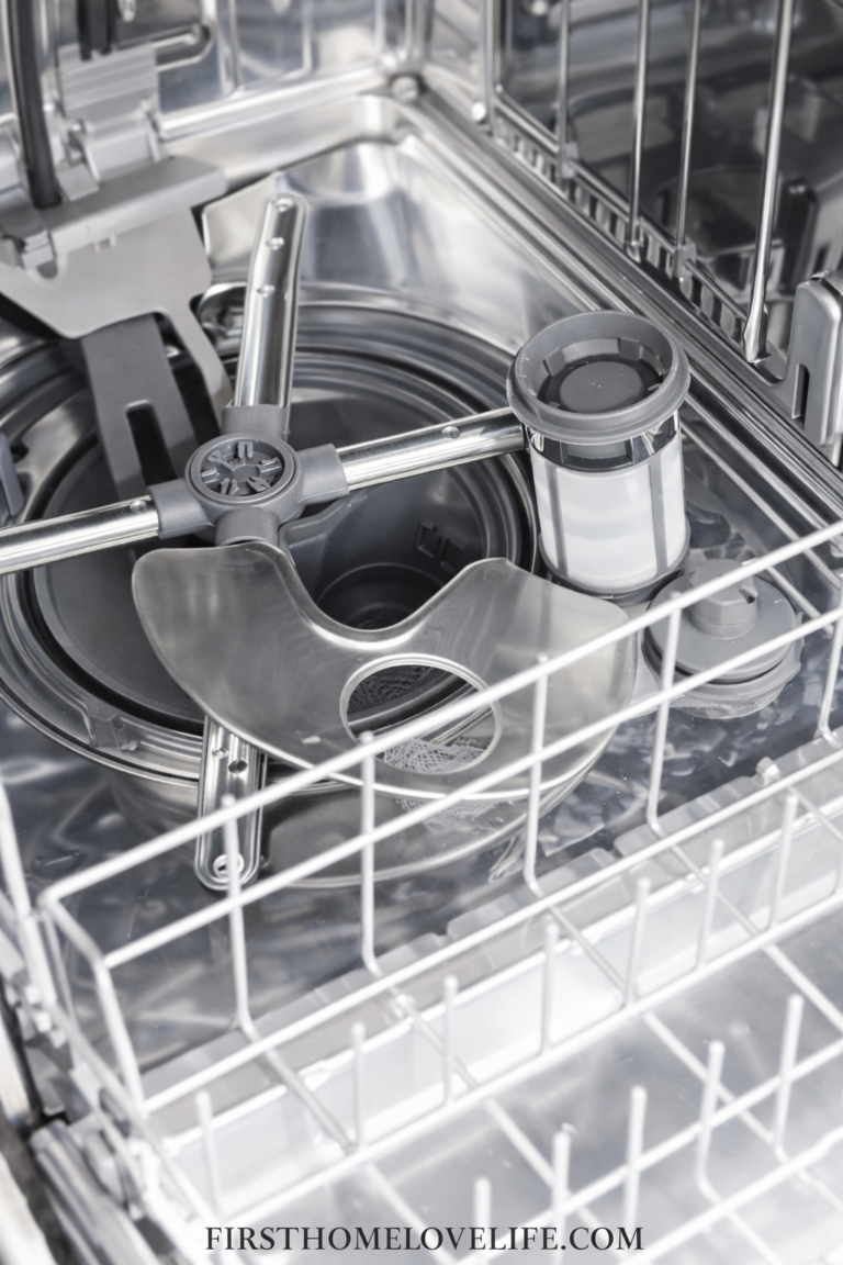 close up of dishwasher filter inside dishwasher being cleaned to improve dishwasher performance