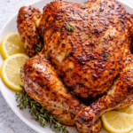 Juicy, golden rotisserie chicken with a savory, slightly sweet marinade inspired by the classic Kenny Rogers flavor