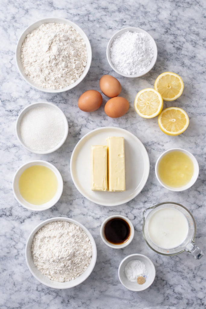ingredients for lemon loaf cake on a marble counter