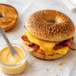 Copycat McDonald’s breakfast sauce with a bacon, egg, and cheese everything bagel sandwich.