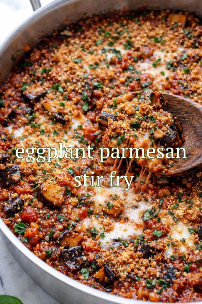 one pan eggplant parmesan stir fry with melted cheese and toasted breadcrumbs in skillet