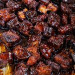 sticky oven baked pork belly burnt ends coated in caramelized barbecue sauce