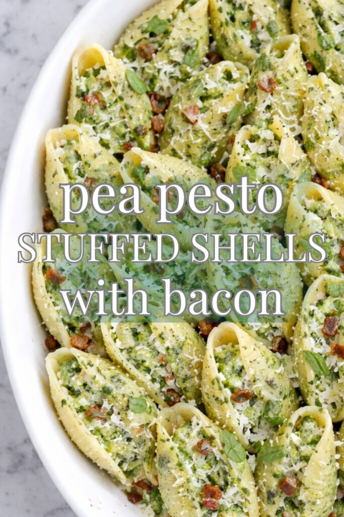 pea pesto stuffed shells with bacon in white baking dish on marble counter
