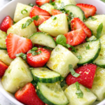 This simple fruit salad is made with juicy strawberries, crisp cucumber, sweet honeydew melon, fresh basil, mint, and a light honey lime dressing. Perfect for brunch, cookouts, spring gatherings, and summer entertaining.