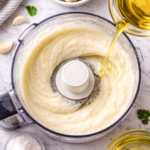 Step by step toum garlic sauce emulsifying with oil drizzle
