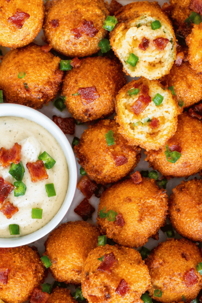 Easy bacon jalapeño hush puppies with ranch dipping sauce, crispy Southern cornmeal fritters loaded with bacon and jalapeños.