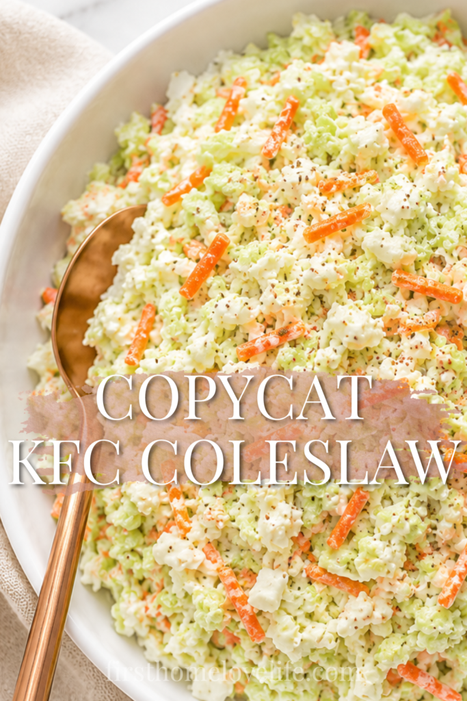 Creamy copycat KFC coleslaw served in a white bowl with shredded cabbage, carrots, celery seed seasoning, and a copper spoon on a marble countertop.