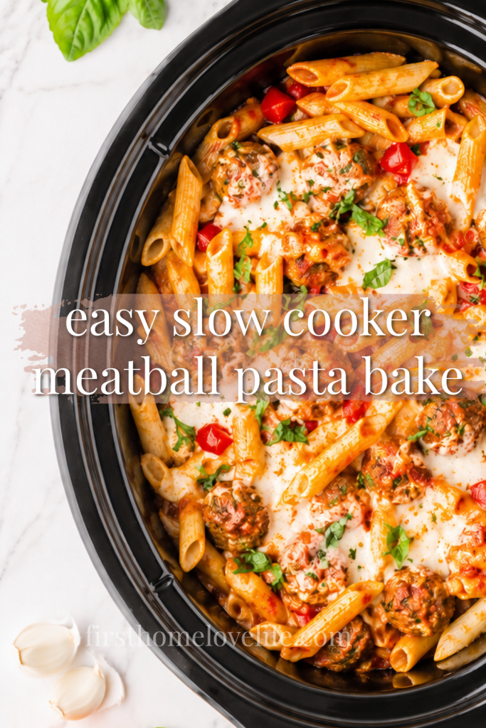 Easy slow cooker meatball pasta bake with penne pasta, mozzarella cheese, meatballs, and basil