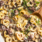 Garlic butter beef tortellini skillet with cheesy tortellini, ground beef, and rich buttery garlic sauce in a white skillet