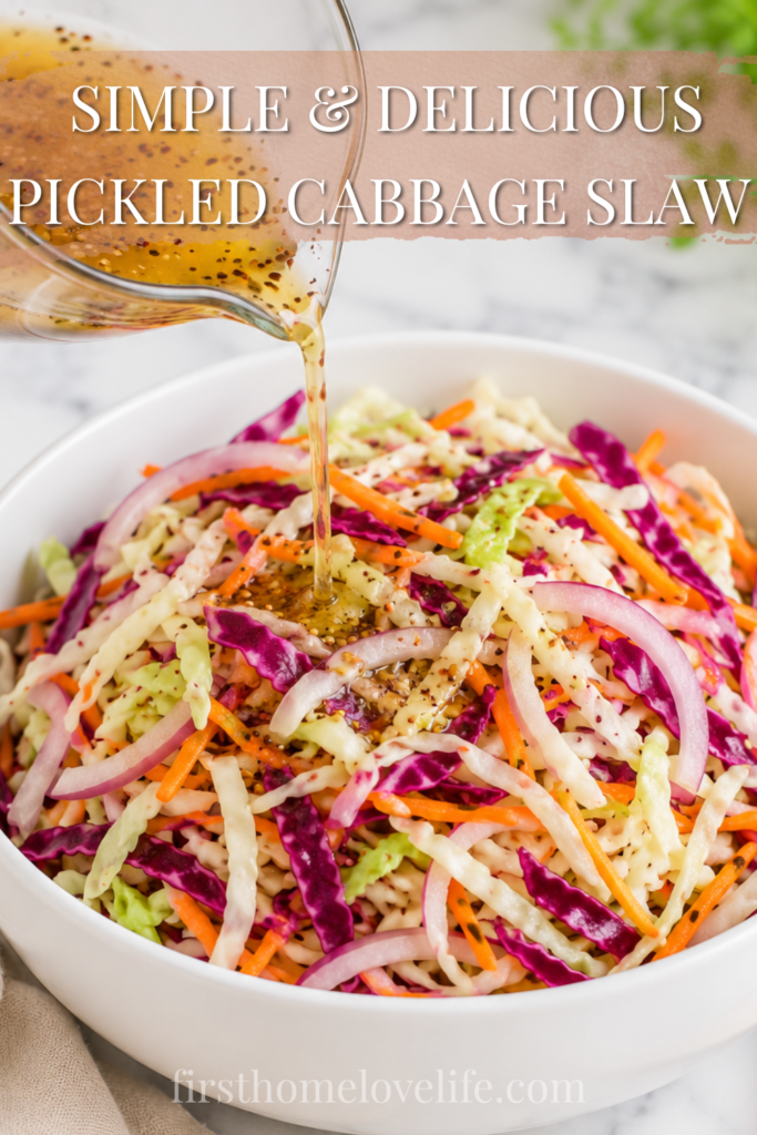 Homemade pickled cabbage slaw with green cabbage, red cabbage, carrots, and red onion as a tangy vinegar brine is poured over the top in a white bowl.