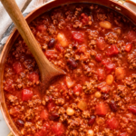 Hearty Italian style chili made with ground beef, Italian sausage, kidney beans, cannellini beans, tomatoes, herbs, and freshly grated Parmesan.